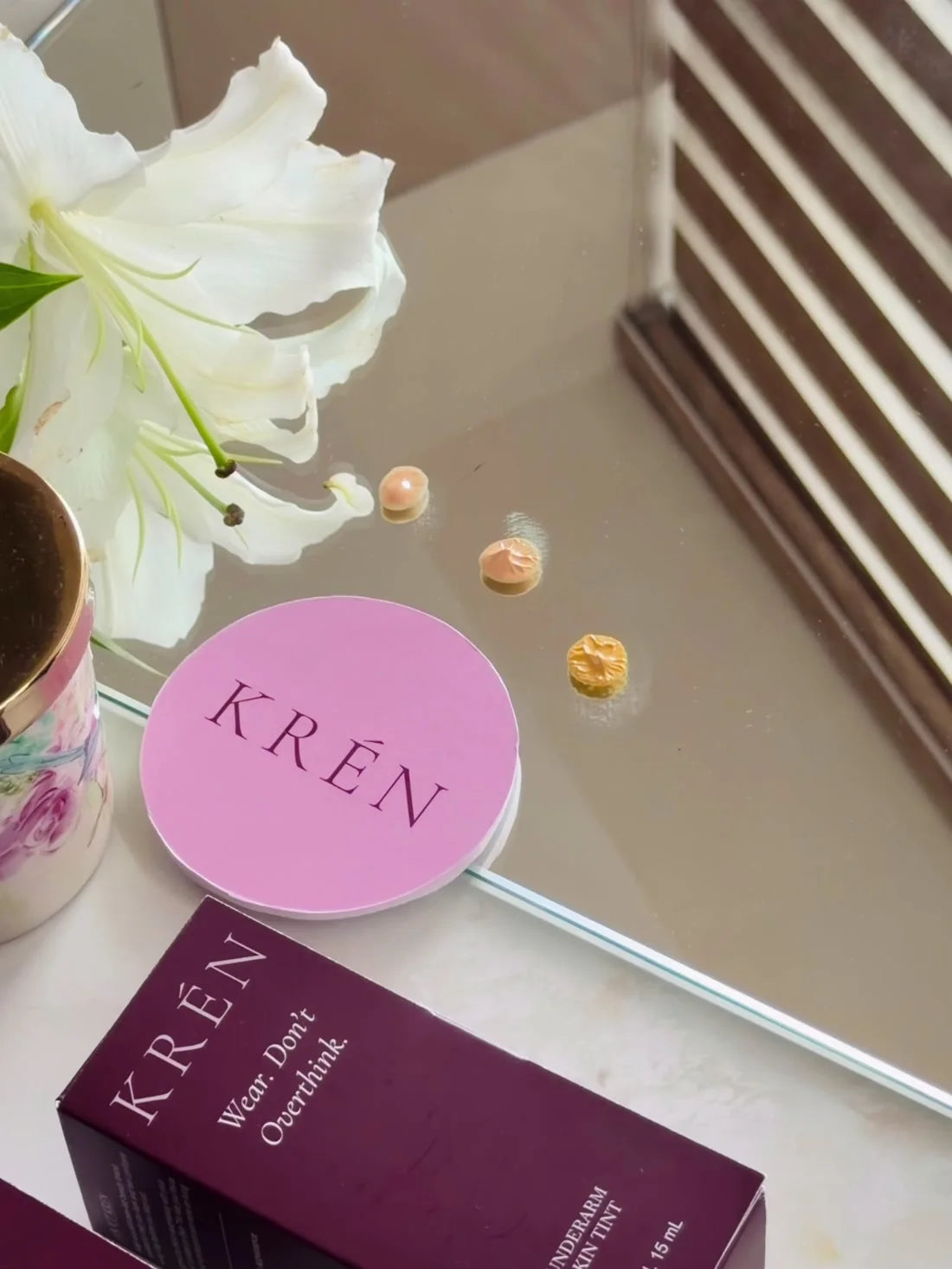 pearl, haze and ember swatched on a mirror tray, with the krén compact